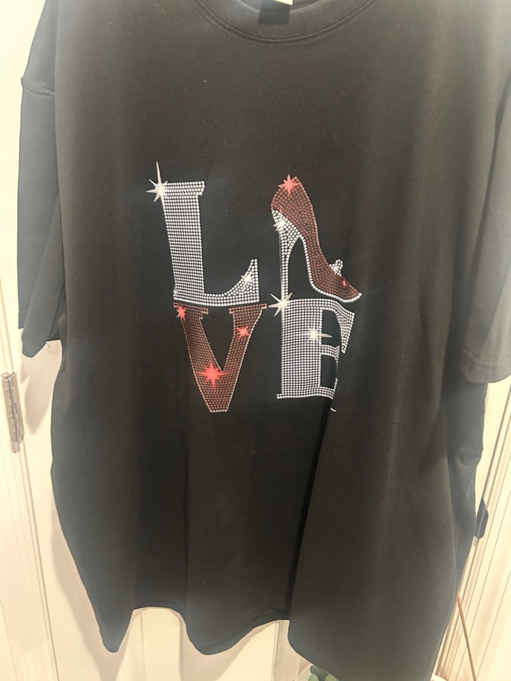 Black Women's Graphic Tee with Red Accent Shoe Detail
